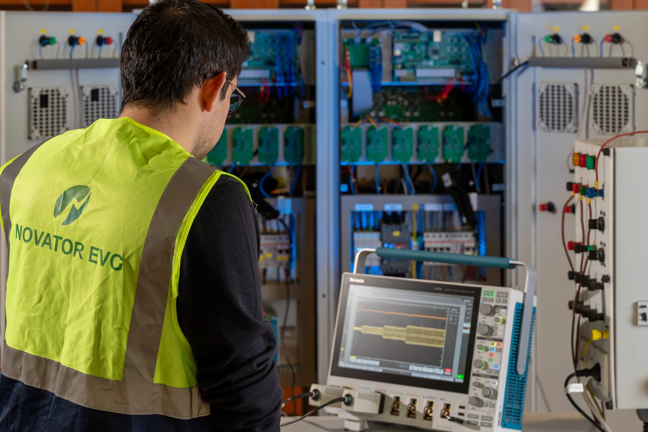 Novator engineer working on industrial electronics